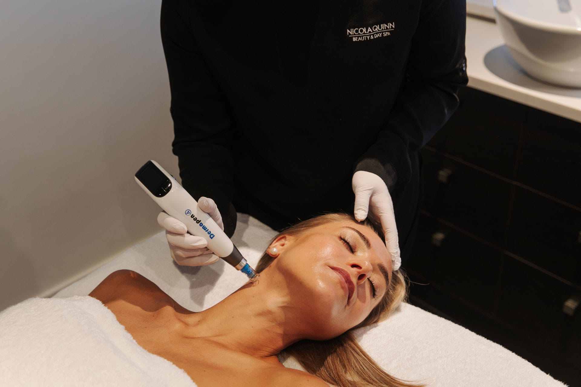 Woman has anti-ageing microneedling dermapen treatment